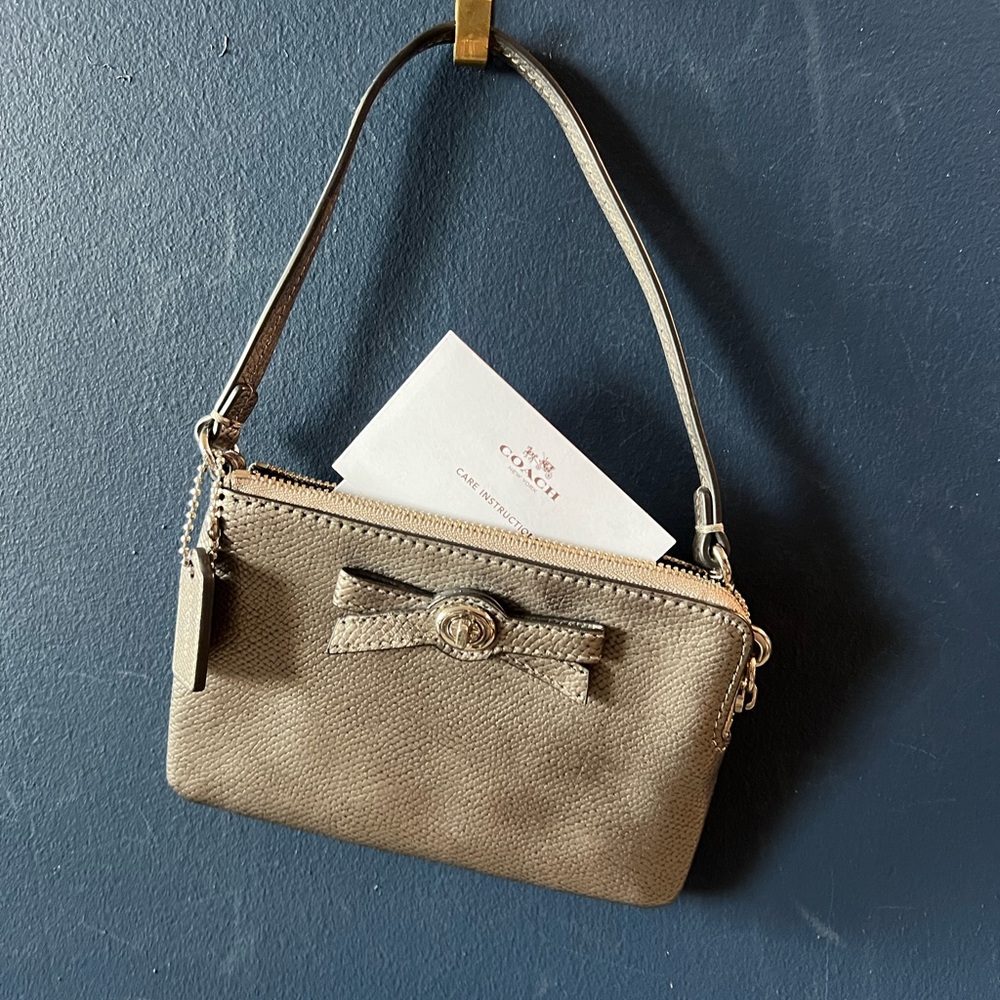 Coach light Gold Leather Wristlet with Bow Accent